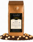 1 lb J.L. Hufford Decaf Macadamia Nut Coffee with coffee beans and macadamia nut in front displayed on a white background
