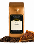 1 lb J.L. Hufford Decaf Pecanilla coffee bag with coffee beans and a slice of buttery pecan pie on a white background