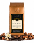 1 lb J.L. Hufford Decaf Vanilla Hazelnut coffee bag with coffee beans, vanilla sticks, and hazelnuts on a white background