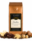 1 lb Brazilian Coffee bag with 'J.L. Hufford' branding and hazelnut, chocolate, vanilla chocolate, and coffee beans on a white background