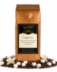 1 lb J.L. Hufford Candy Corn Coffee with coffee beans, vanilla, and marshmallows in front displayed on a white background