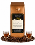 1 lb Coffee bag labeled 'Chocolate Amaretto' by J.L. Hufford with two shot glasses of amaretto, chocolate shavings, and coffee beans.