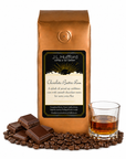 1 lb J.L. Hufford Chocolate Butter Rum coffee bag with coffee beans, milk chocolate bar, and a glass of rum on a white background