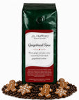 1 lb Gingerbread Spice coffee beans bag with coffee beans and gingerbread cookies in front displayed on a white background
