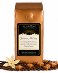 1 lb J.L. Hufford Jamaican Me Crazy coffee bag with coffee beans, blocks of caramel, and vanilla sticks on a white background