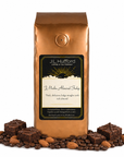 1 lb J.L. Hufford J Mocha Almond Fudge coffee bag with coffee beans, almonds, and fudge brownies on a white background