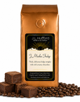 1 lb J.L. Hufford J Mocha Fudge coffee bag with coffee beans and fudge blocks on a white background