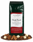 1 lb Kringle Krunch coffee beans bag with coffee beans, pecan, praline, and white chocolate fudge in front displayed on a white background