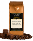 1 lb J.L. Hufford Mackinac Island Fudge coffee bag with coffee beans and fudge blocks on a white background