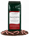 1 lb Peppermint Candy Cane coffee beans bag with coffee beans and peppermint candy canes in front displayed on a white background