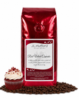1 lb Red Velvet Cupcake coffee beans bag with coffee beans and red velvet cupcake in front displayed on a white background
