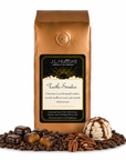 1 lb J.L. Hufford Turtle Sundae coffee bag with coffee beans, pecans, chocolate covered caramel candies, and ice cream with drizzled caramel and fudge on a white background
