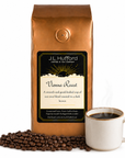 1 lb J.L. Hufford Vienna Roast coffee bag with coffee beans and mug of coffee on a white background