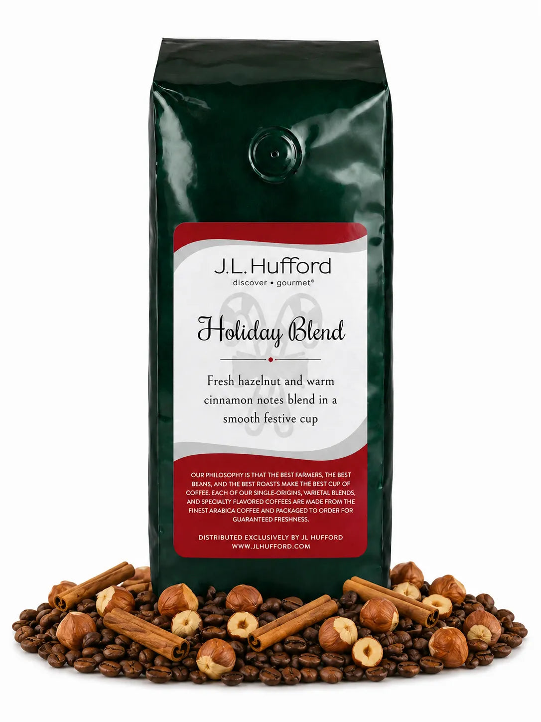 1 lb Holiday Blend coffee beans bag with coffee beans, hazelnuts, and cinnamon sticks in front displayed on a white background