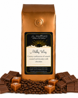 1 lb J.L. Hufford Milky Way coffee bag with coffee beans, chocolate, and blocks of caramel on a white background