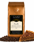 1 lb J.L. Hufford Pecanilla coffee bag with coffee beans and a slice of buttery pecan pie on a white background