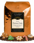 5 lb Decaf Christmas Cookie coffee beans bag with coffee beans and Christmas cookies in front displayed on a white background