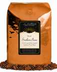 5 lb J.L. Hufford Decaf Southern Pecan coffee bag with coffee beans and pecans on a white background