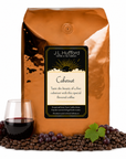 5 lb J.L. Hufford Cabernet coffee bag with coffee beans, red grapes, and a glass of cabernet on a white background