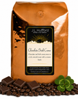 5 lb Chocolate Irish Creme coffee beans bag with coffee beans, blocks of chocolate, and four-leaf clover in front displayed on a white background