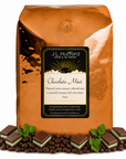 5 lb J.L. Hufford Chocolate Mint Coffee beans bag with coffee beans and chocolate mint blocks in front displayed on a white background