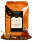 5 lb J.L. Hufford Honey Dipped Pecan coffee bag with coffee beans, pecans, honey, and jar of maple on a white background