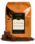 5 lb J.L. Hufford J Mocha Fudge coffee bag with coffee beans and fudge blocks on a white background