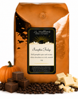5 lb J.L. Hufford Pumpkin Fudge coffee bag with coffee beans, pumpkin, blocks of fudge, and blocks of white chocolate on a white background