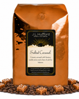 5 lb J.L. Hufford Salted Caramel coffee bag with coffee beans and blocks of salted caramel on a white background