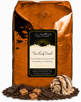5 lb J.L. Hufford Tin Roof Swirl Coffee with coffee beans, chocolate bars, caramel blocks, and ice cream with drizzled fudge and caramel in front displayed on a white background