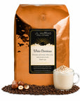 5 lb J.L. Hufford White Christmas coffee bag with coffee beans, hazelnuts, and white cocoa drink on a white background