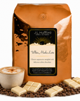 5 lb White Mocha Latte coffee beans bag with coffee beans, white chocolate bars, and a mug of cappuccino in front displayed on a white background