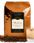 5 lb J.L. Hufford White Russian coffee bag with coffee beans, spices, and white Russian in a glass on a white background