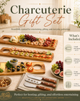 Charcuterie gift set with wooden boards, knives, and food on a table. Including on small, one large and one medium charcuterie board and a 3 piece cheese knife set