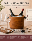 Deluxe wine gift set with teak wine cooler, glasses, and accessories on a wooden surface.