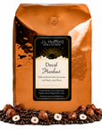 5 lb J.L. Hufford Decaf Hazelnut coffee bag with coffee beans and hazelnuts on a white background