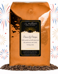 5 lb Stars & Stripes coffee beans bag with coffee beans in front displayed on a white background with fireworks