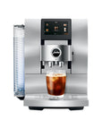 Front view of Aluminum White Jura espresso machine with an iced coffee in glass cup on stand displayed on a white background