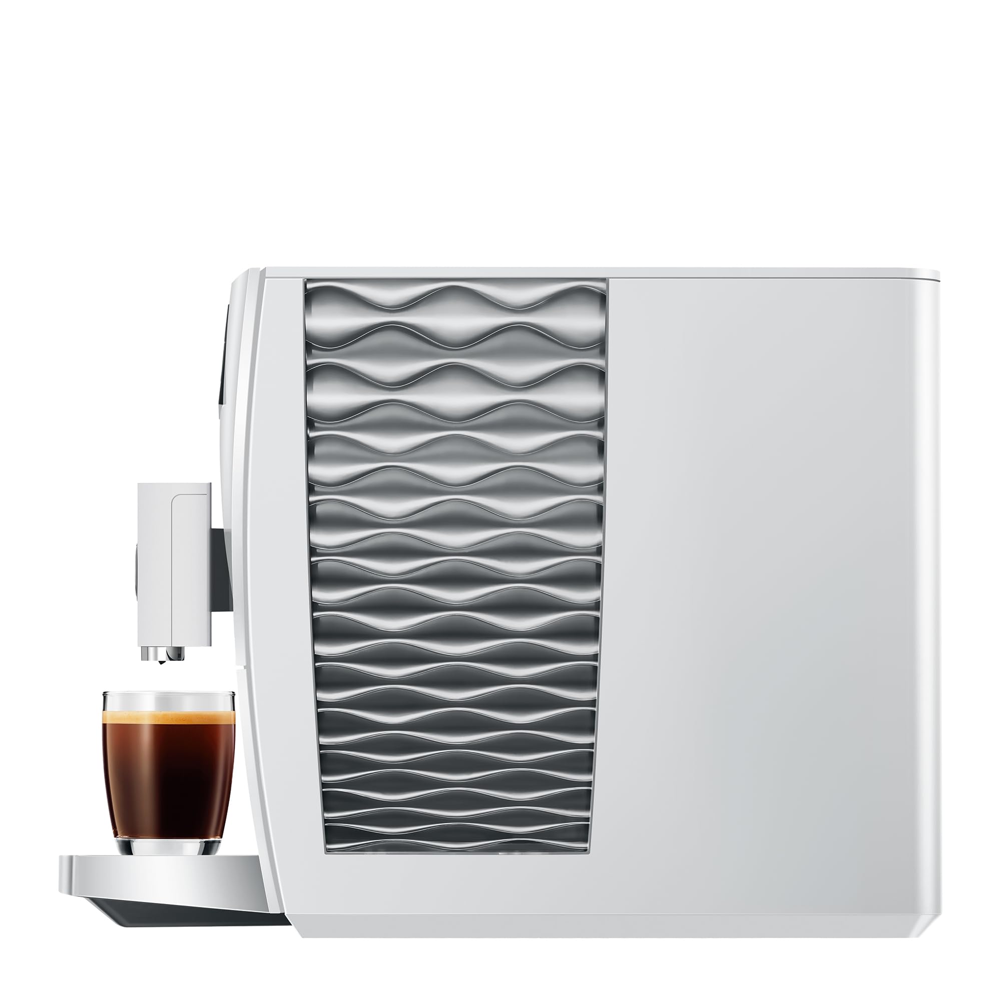White coffee machine with wavy design next to a glass of coffee on a white background