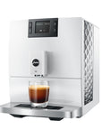 White coffee machine with a glass of espresso on a white background