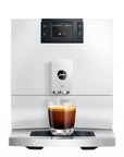 White coffee machine with a glass of espresso on a white background