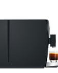 Black coffee machine with a glass of coffee on a white background
