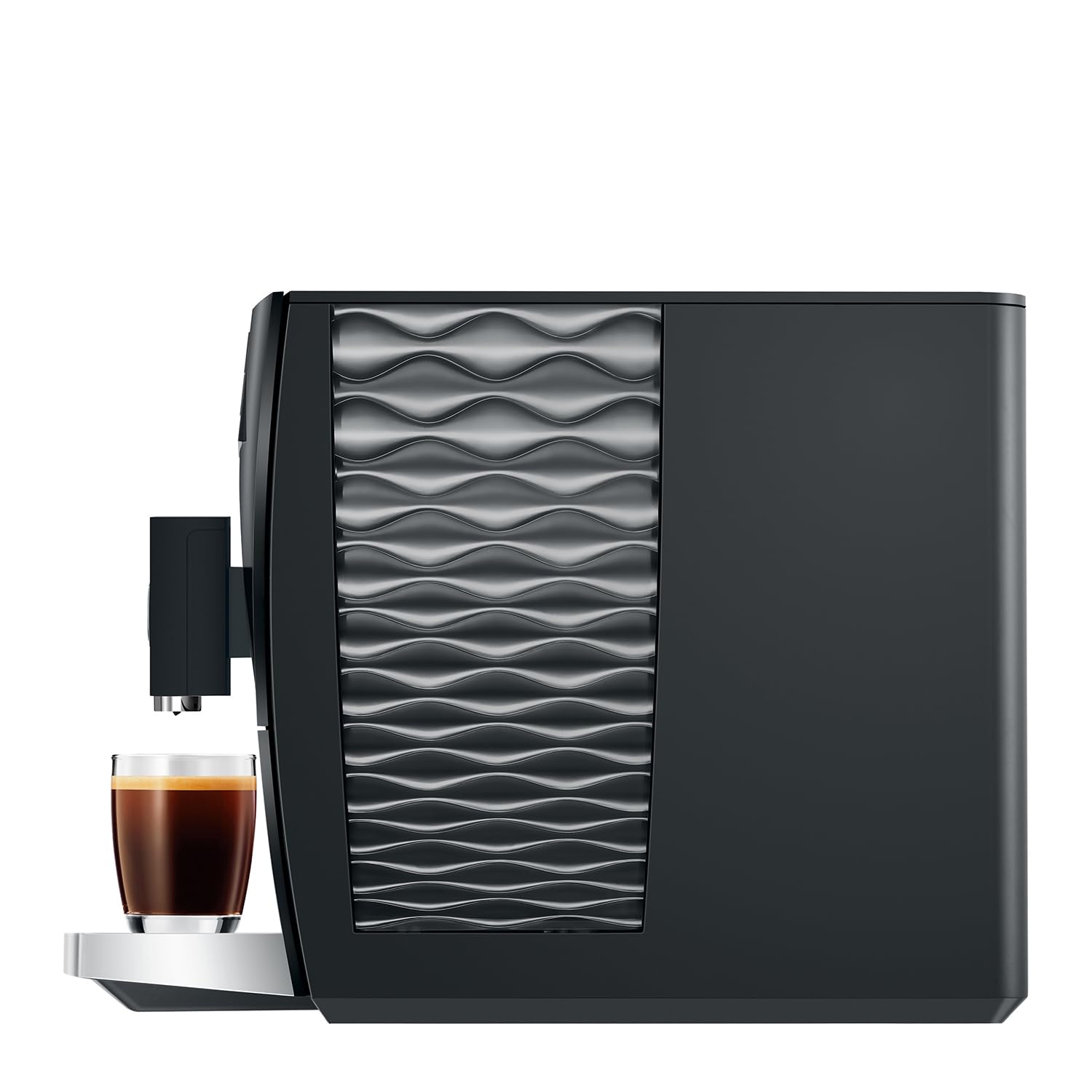 Black coffee machine with wavy design next to a glass of coffee on a white background