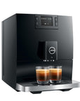 Black coffee machine with two glasses of coffee on a white background