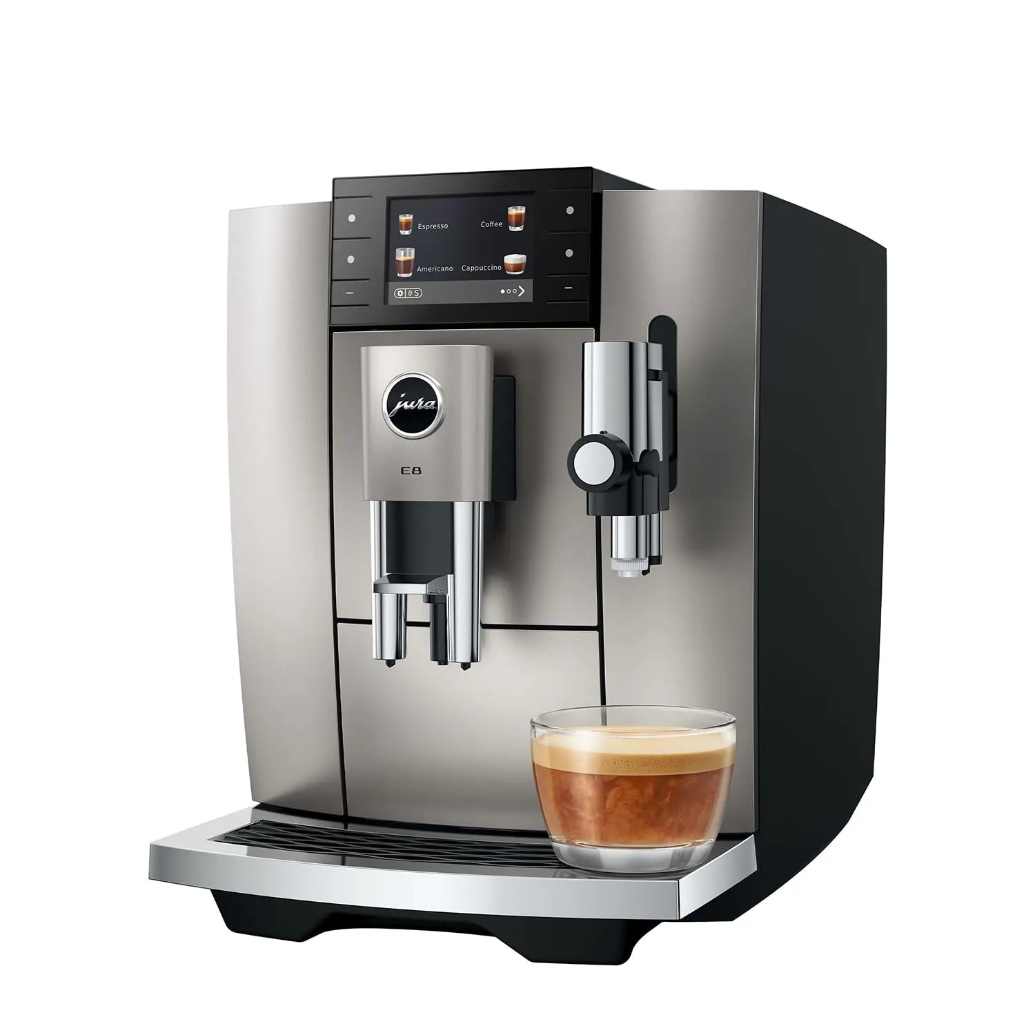 A Jura coffee machine in brushed stainless steel and black, shown with a glass of espresso on the drip tray against a white background.