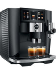 Black and silver Jura coffee machine with two glasses of espresso on a white background