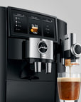 Jura coffee machine with a glass of coffee on a gray background