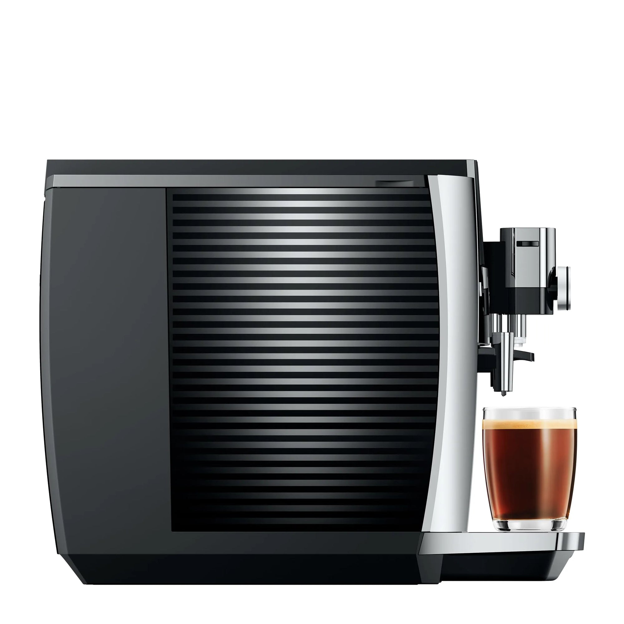 Side view of black and silver coffee machine with a glass of coffee on a white background