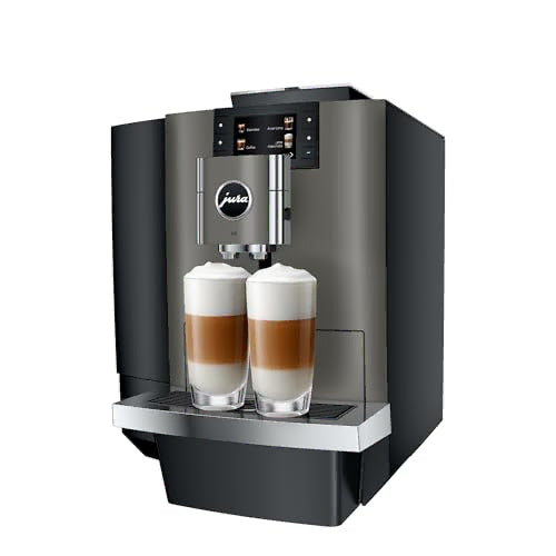 A Jura commercial-style coffee machine in dark gray and black, shown with two tall glasses of layered latte macchiato on the drip tray, against a plain white background.