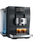 A sleek black and stainless steel Jura Z800 espresso machine with two glasses of freshly brewed espresso on its tray, set against a solid white background.